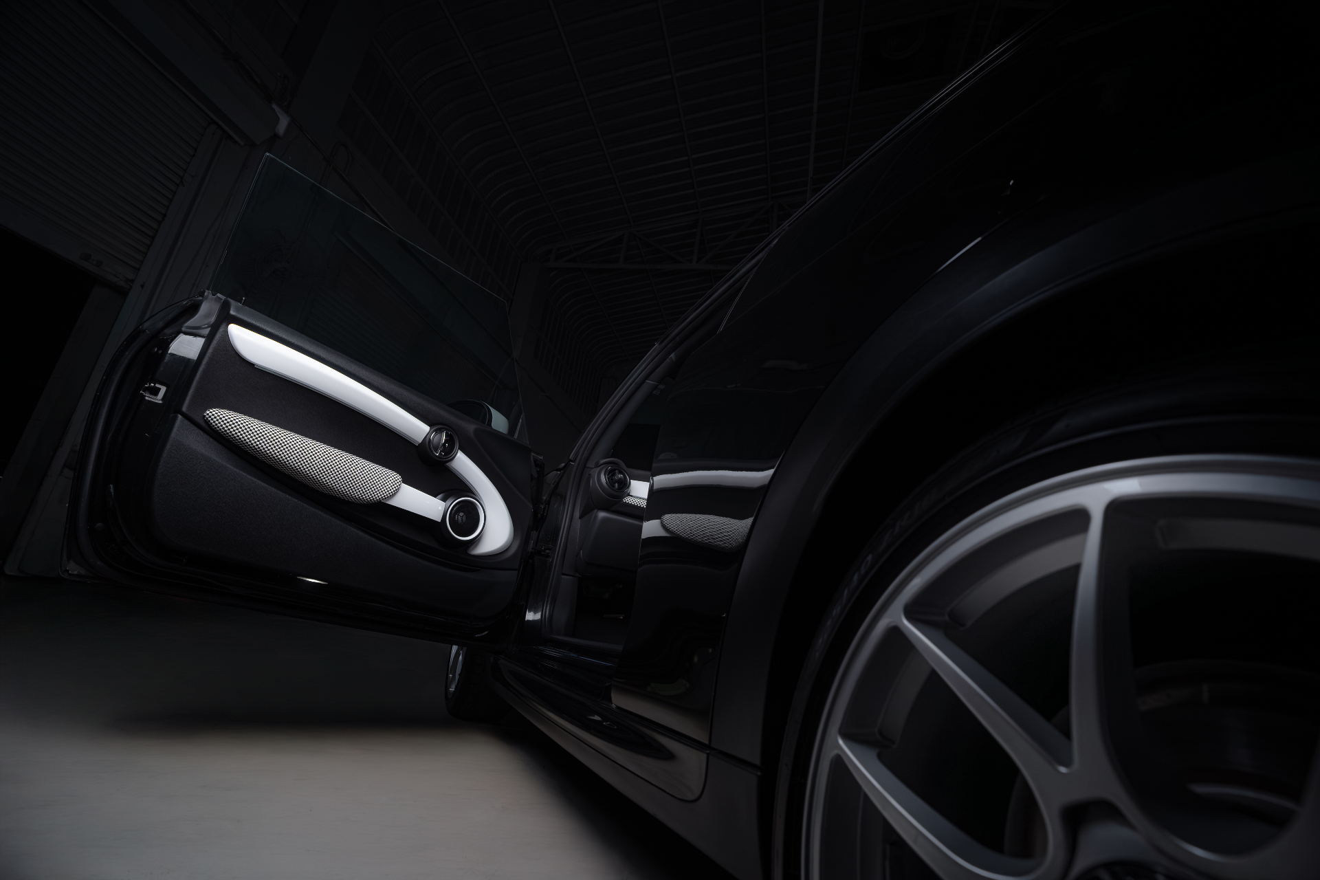 Mini with door open revealing bespoke interior